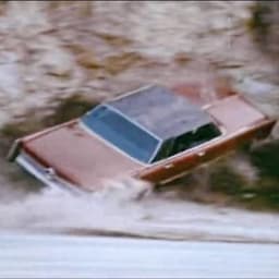 Unikitty driving a Lincoln Continental